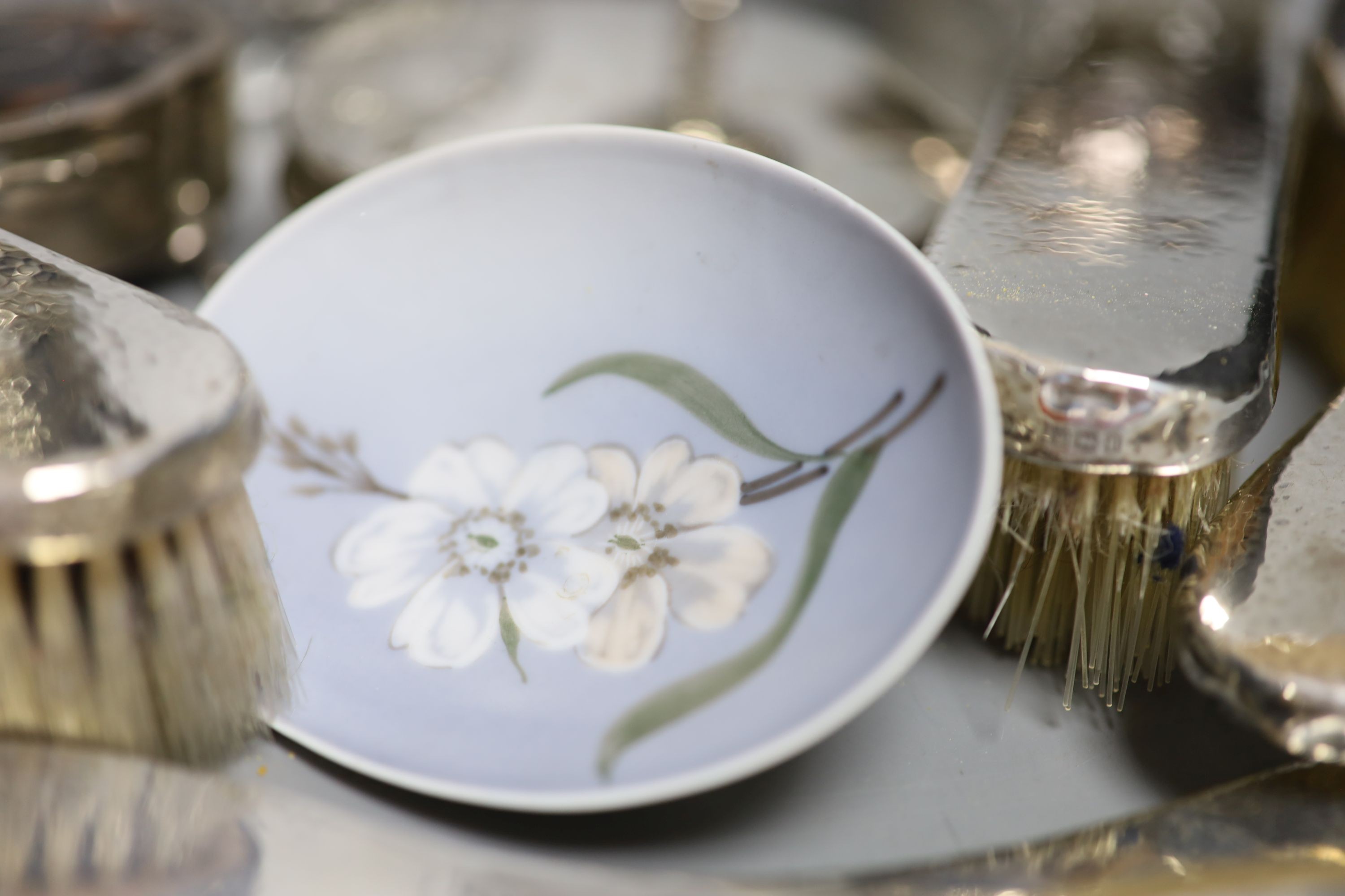 A George V hammered silver ten piece dressing table set with tray, engraved 'Stella' and six other items including a silver circular powder box?, a tortoiseshell mounted trinket box and two plate goblets.